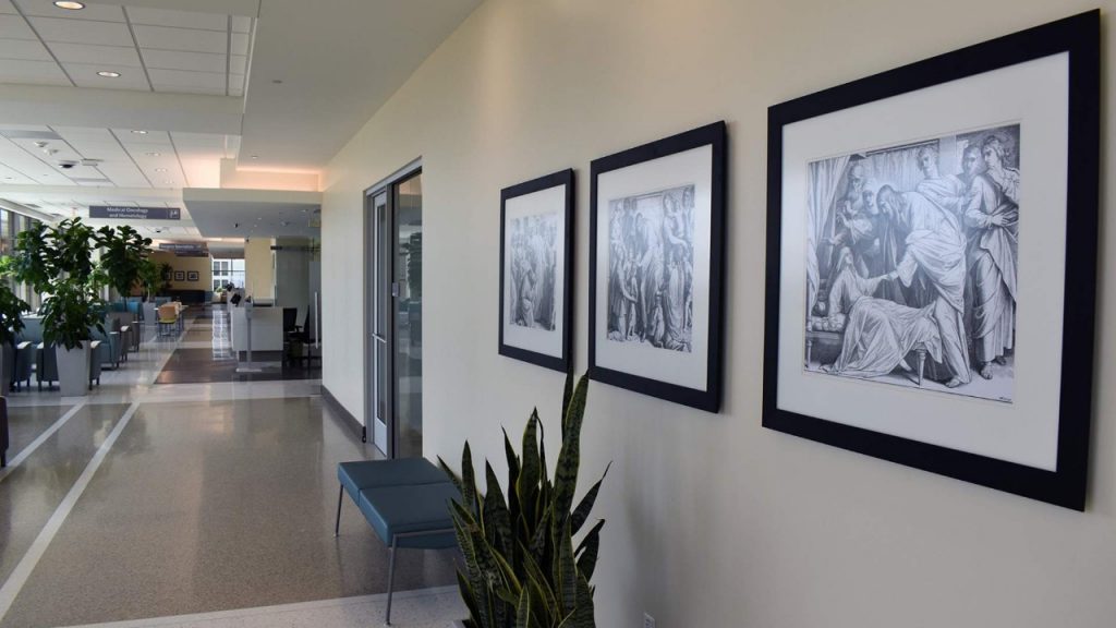 A view down one of the hallways of the David M. Sindelar Cancer Center with its inspirational artwork.