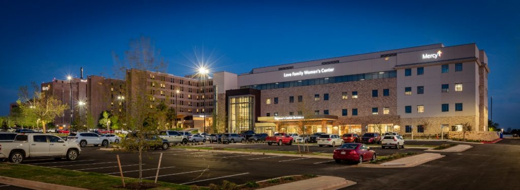 An exterior photo at dusk of Mercy Hospital Oklahoma City with a graphic that says Leapfrog Hospital Safety Grade A Spring 2025