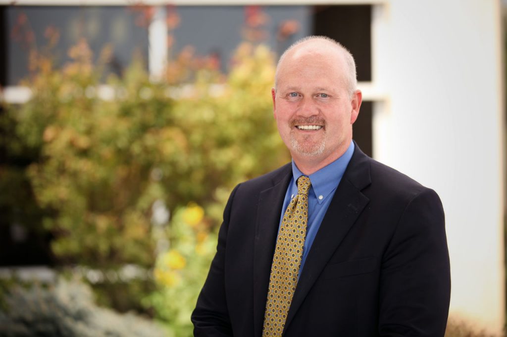 Head shot of Daryle Voss in a suit and tie.