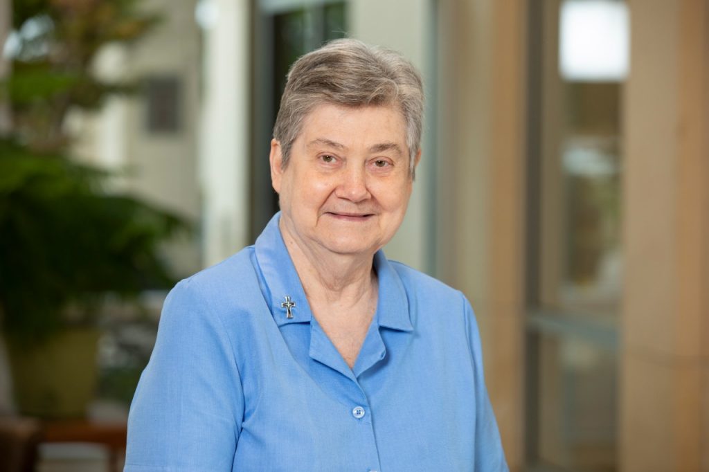 Head shot of Sister Carolyn Stoutz in a blue blouse.
