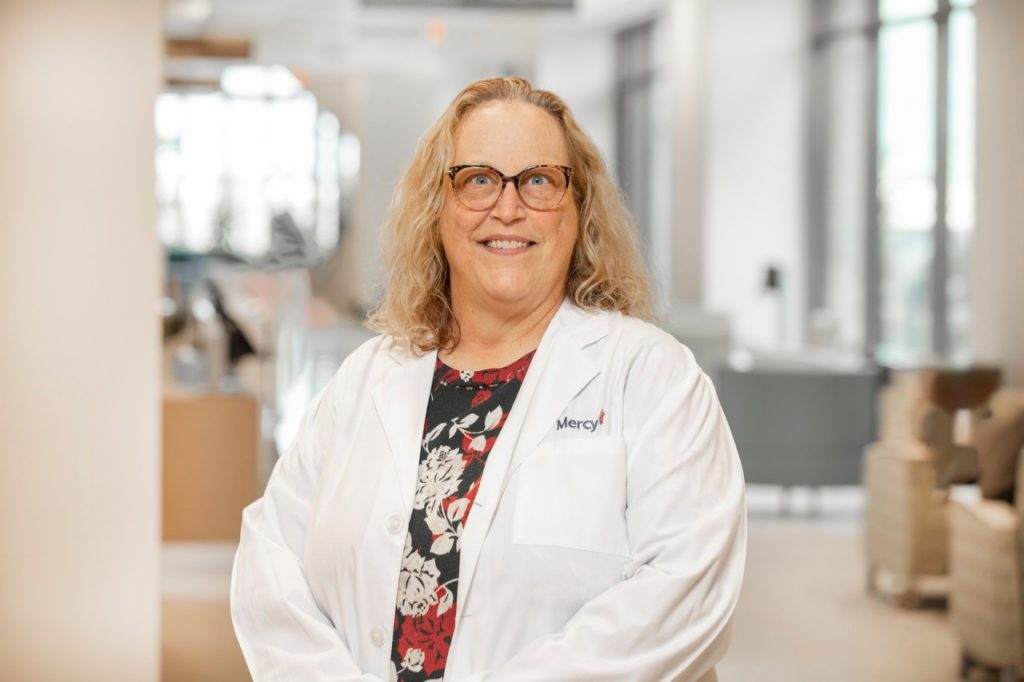 Head shot of Dr. Lori Ford in a white lab coat.
