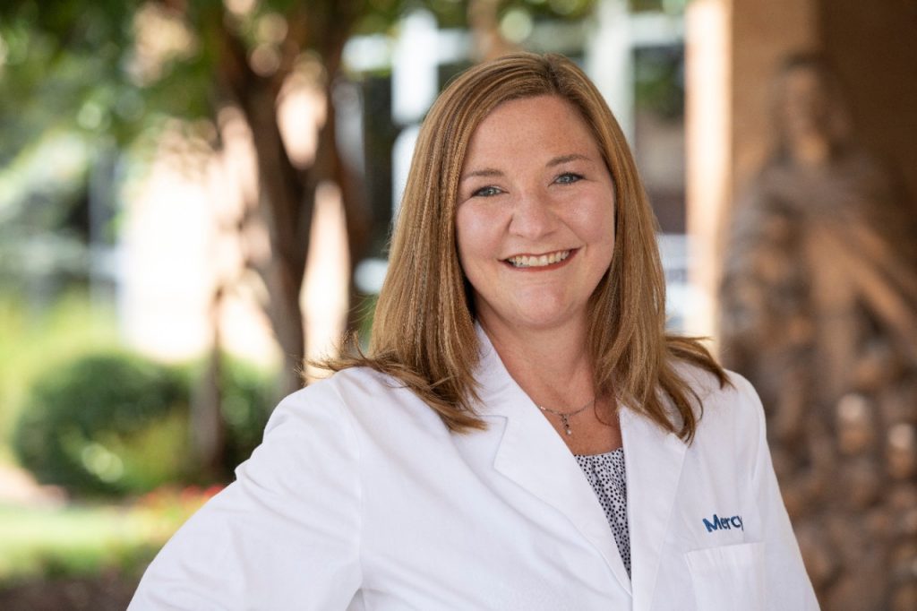 Head shot of Jerri Bradshaw in a white lab coat