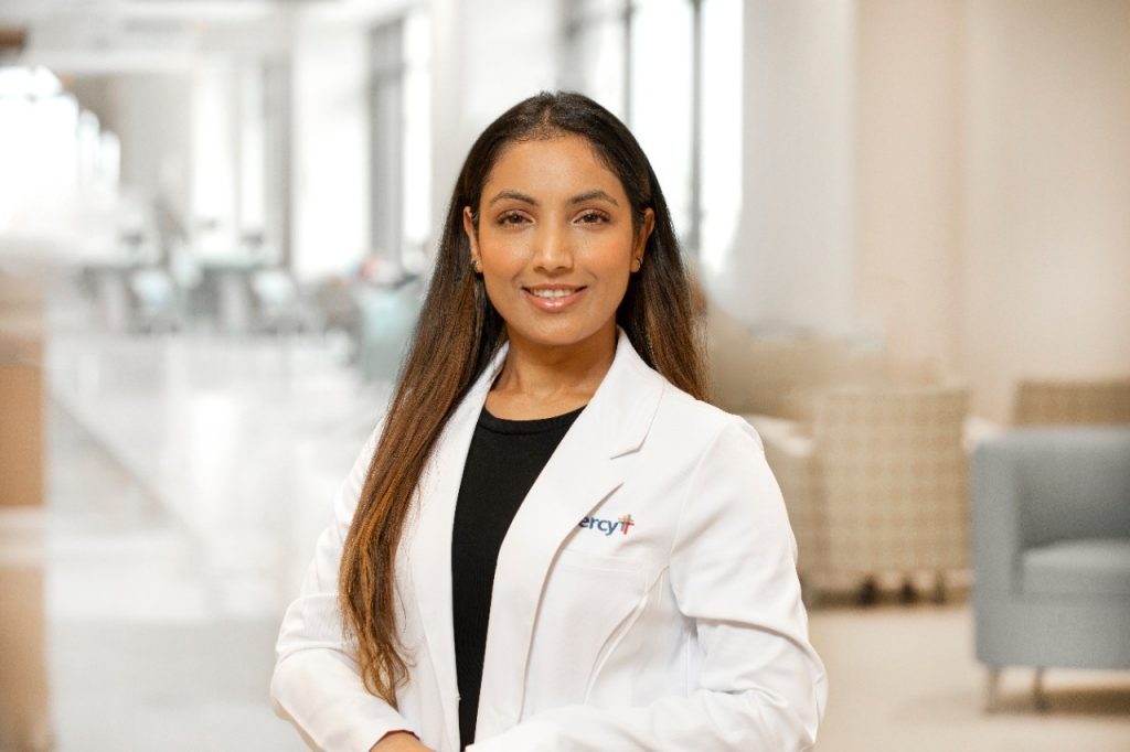 Head shot of Dr. Bidhya Pandey in a white lab coat.