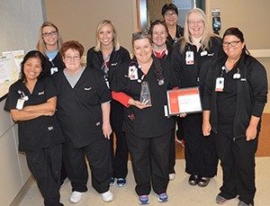Co-workers celebrate with Kelly Duff, RN, one of three winners of Mercy Jefferson Professional Practice awards.
