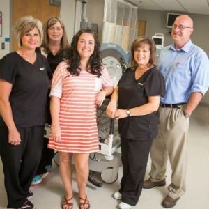 Denise Baker (center) received 20 hyperbaric oxygen therapy treatments last fall to help heal wounds from breast reconstructive surgery.
