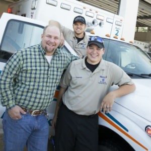 Mercy paramedics Kenny Dalton and Casey Fowler pose with Josh Britt