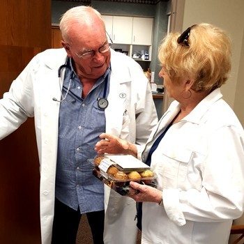 Dr. Hite chats with patient Margi Burtin, exactly 50 years after her first visit.