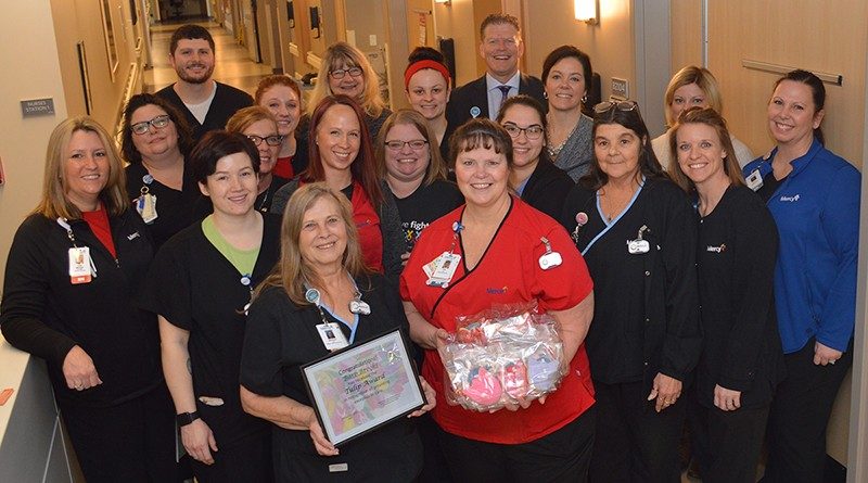 Several of her co-workers and Mercy Jefferson leaders were on hand when Barb Brooks received her Tulip Award.