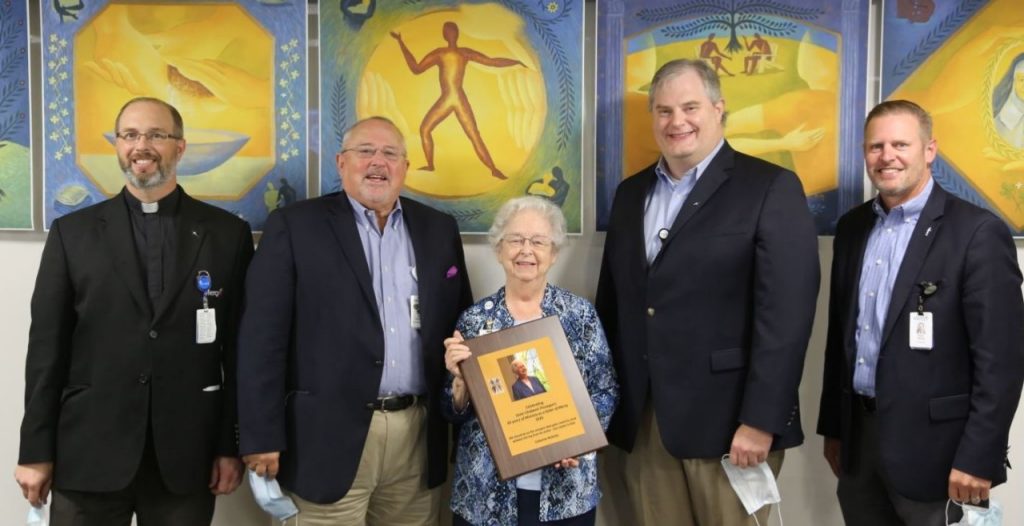 Sister Chabanel Finnegan was honored with a plaque on Mercy Day in September 2020. Pictured are Father Paul Fetsko, from left, Dr. David Hunton, Dr. Paul Bean and Ryan Gehrig.