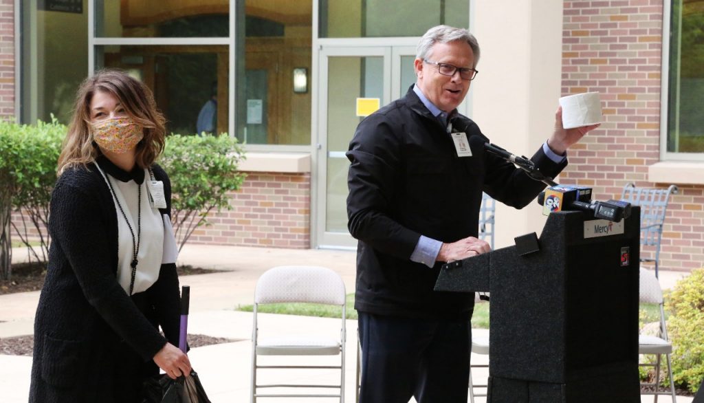 Dr. Steve Goss, president of Mercy Clinic, offers a humorous take during his reflection of COVID-19 during the "Brighter Days Ahead Because of You" event on Monday. Holli Oliver, director of mission and volunteers, looks on.