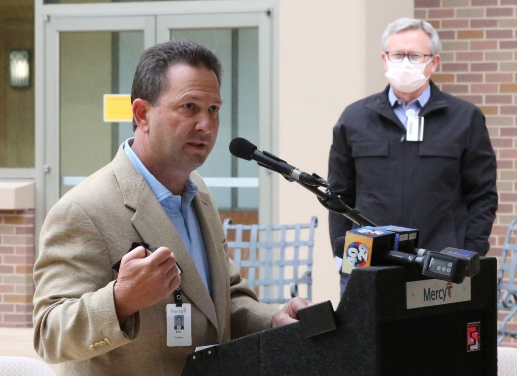 Eric Pianalto, president of Mercy Hospital, offers his thanks to Mercy Northwest Arkansas co-workers Monday during the "Brighter Days Ahead Because of You" event while Dr. Steve Goss, president of Mercy Clinic, looks on.