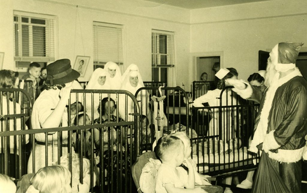 The polio unit at Mercy Hospital in Vicksburg, Mississippi, Christmas 1947. Pictured are Sisters Chabanel Finnegan and Marian Strohmeyer.