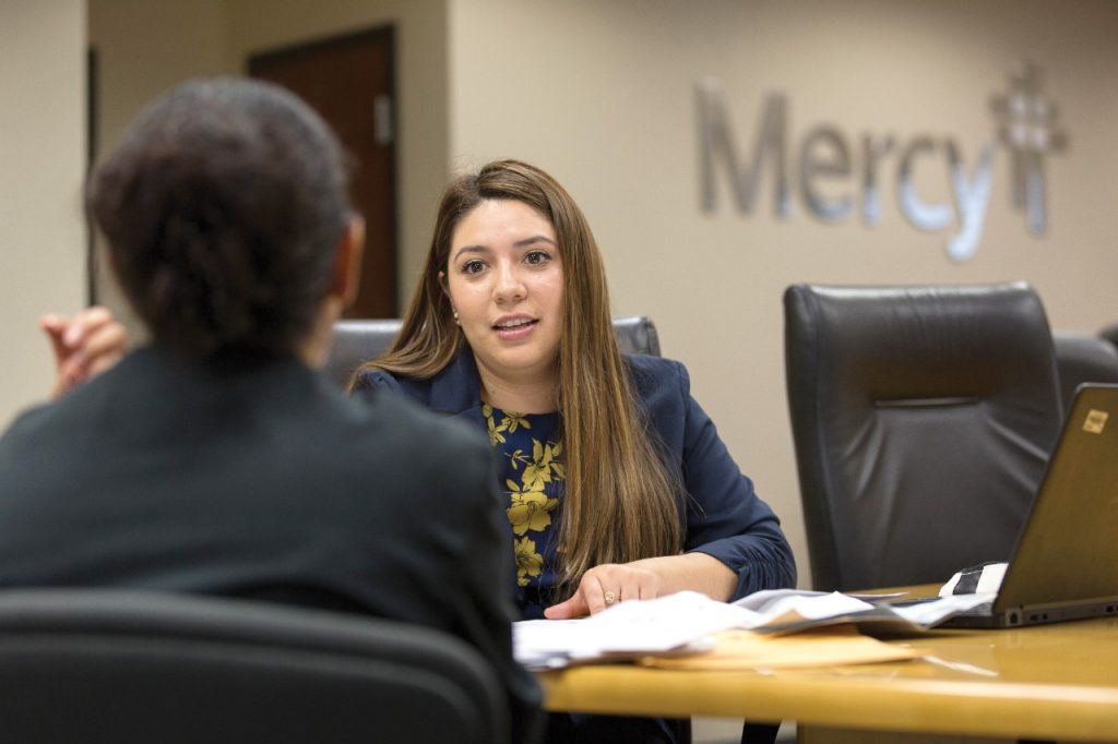 Clinic Without Walls coordinator Elizabeth Hernandez interviews a new participant to the program. (Permission granted from Catholic Health World, February 15, 2018
Copyright © 2018 by The Catholic Health Association of the United States.)