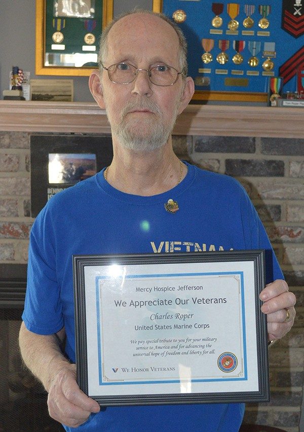 Sgt. Tom Roper with his certificate from Mercy Hospice Jefferson.