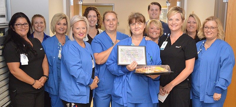 Surrounded by several of her co-workers, Christina Avis was presented the quarterly Tulip Award at Mercy Hospital Jefferson.