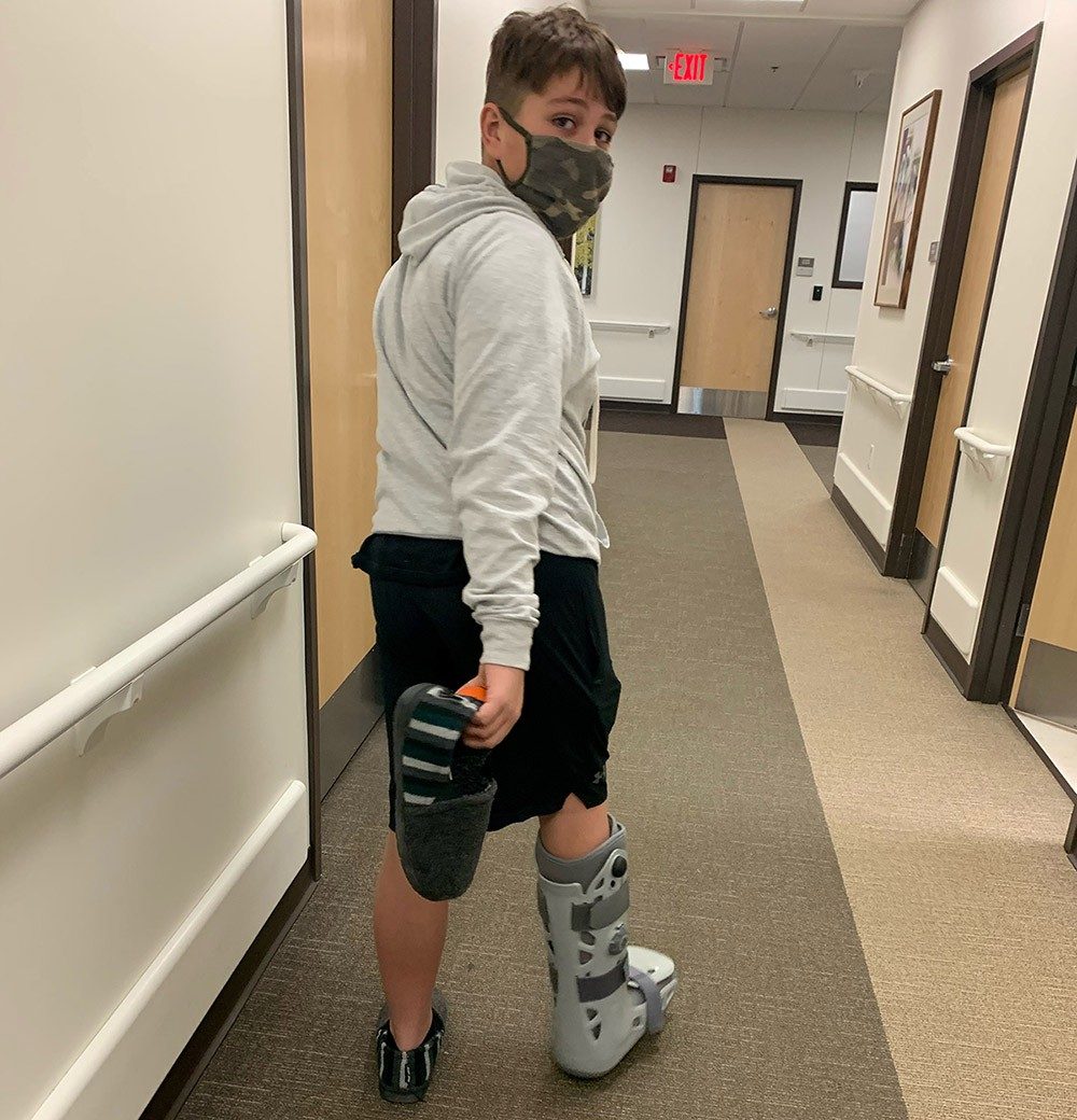 Gage Green injured his Achilles tendon during a game. Like his sister, he left Mercy Orthopedic Walk-in Care in a boot.