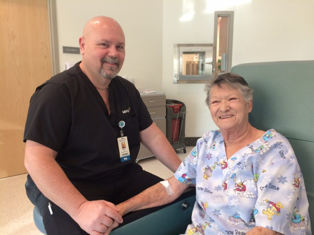 Paul Cook, RN at Mercy Cancer Center in Joplin, and Bonnie Brown share encouraging words and a laugh before an appointment. 