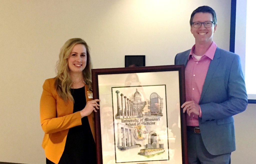 Kelly Risby, University of Missouri School of Medicine senior program/project support coordinator, presented Dr. Russell Kennedy, Mercy family medicine physician, with the Distinguished Community-Based Faculty Award during the Mercy Clinic All Provider Meeting on Thursday, May 10.