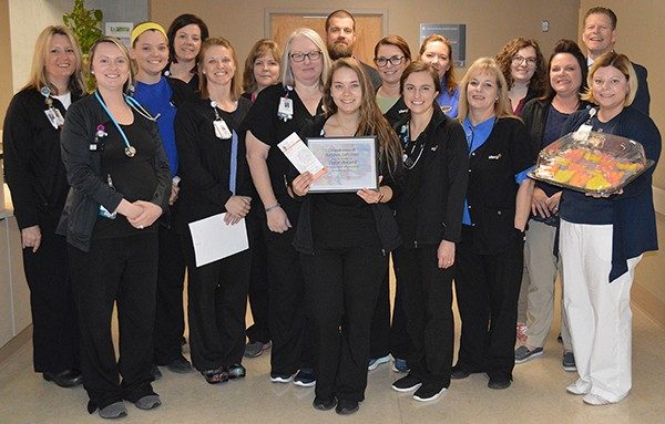 Surrounded by her co-workers, Kristen Sampson was honored as the quarterly Tulip Award winner at Mercy Hospital Jefferson.