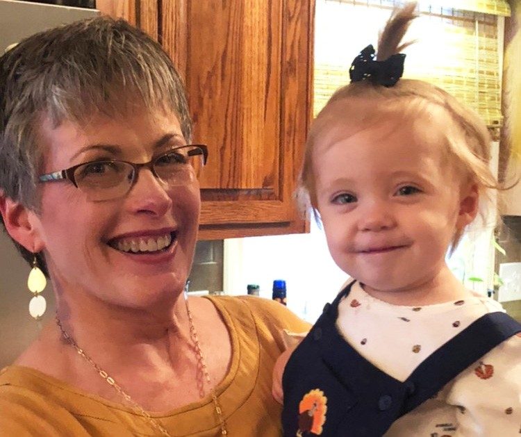Lori Marble with her granddaughter, Poppy. Since getting deep brain stimulation surgery, Marble is now able to hold Poppy without worry.