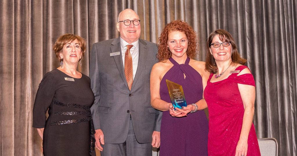 Erin Poniewaz (third from left) was honored with the NAMI St. Louis' Mortimer Goodman Award.