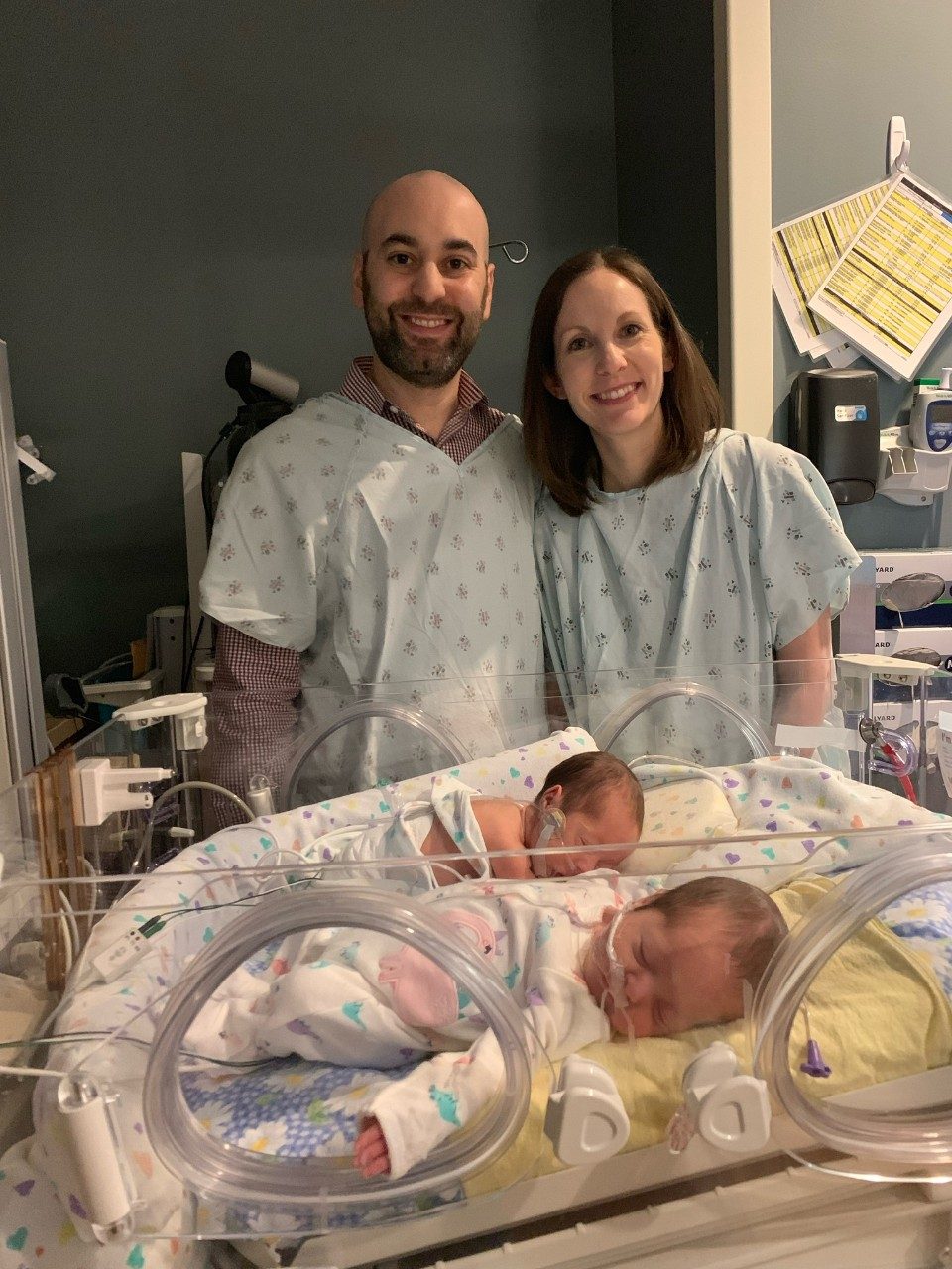 Matthew and Amy Lawrence in the Mercy neonatal intensive care unit with their twin girls Juliet Carol and Madison Antoinette.