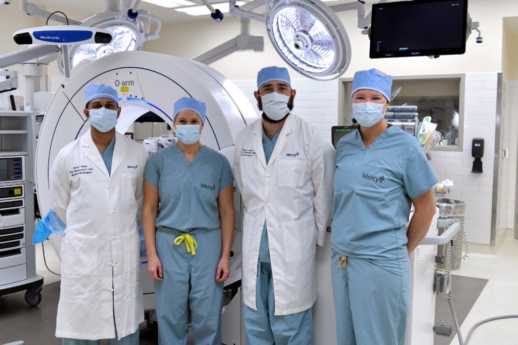 Pictured in front of Mercy’s Medtronics O-Arm is Mercy Northwest Arkansas’ neurosurgery team: Dr. Raj Nangunoori, nurse practitioner Kali Eddy; Dr. Alejandro Castellvi; and nurse practitioner Paula Stephens.