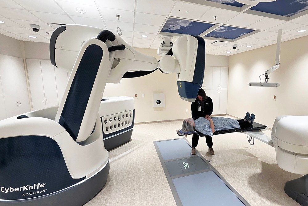 A photo showing the placement of a patient with the CyberKnife robotic radiation treatment technology.