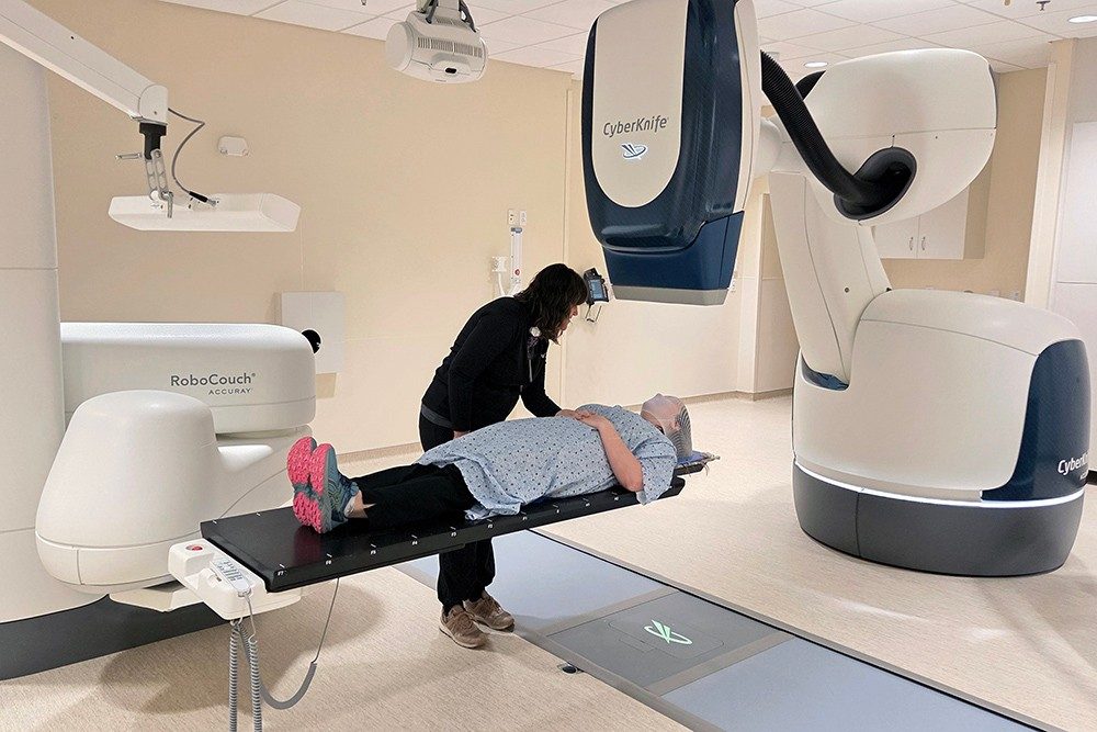 A photo showing the placement of a patient with the CyberKnife robotic radiation treatment technology.