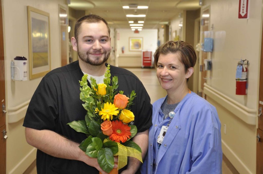 Jarek Frein, patient care associate with 8 West/Neuro, with his mother, Tonya Loos, RN, PACU.