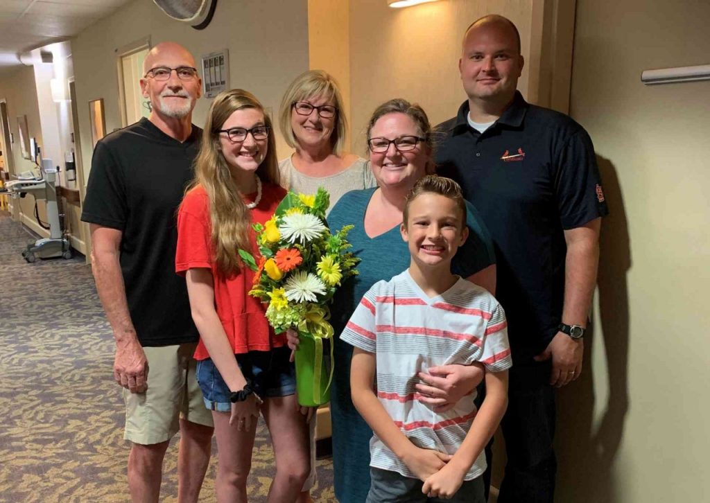 The family of Jennifer Wooldridge, RN, Mercy Birthplace - South, joined her as she was honored with a DAISY Award.