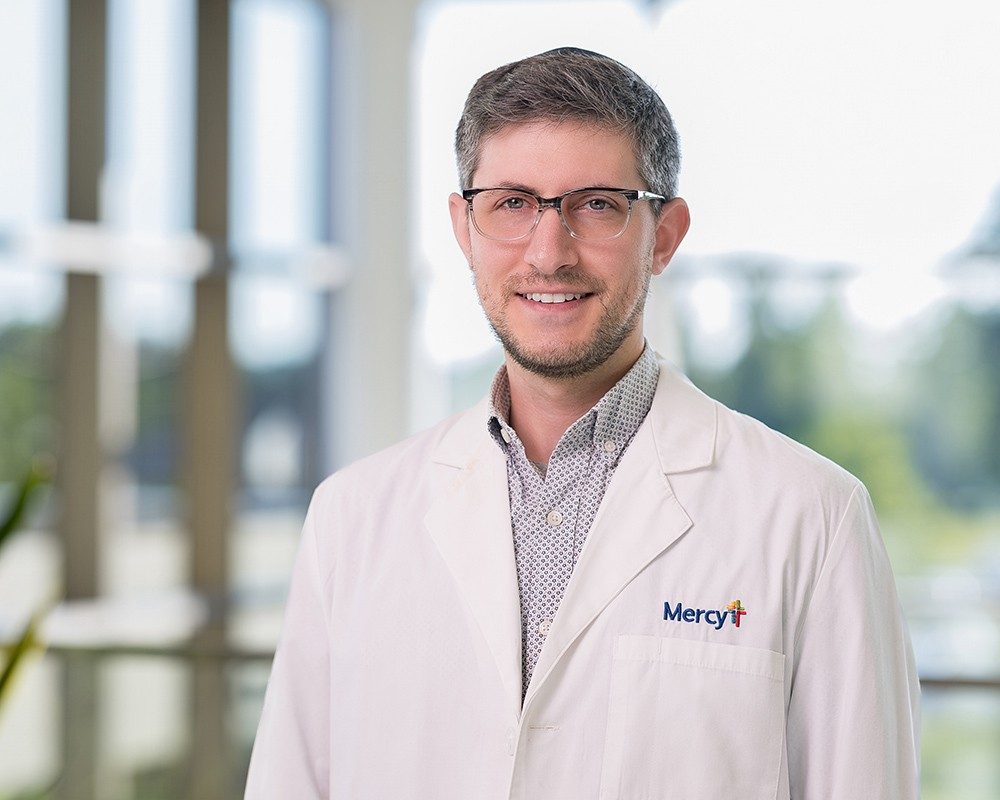 Marshall Kirsch, D.O., neurologist wearing a white lab coat with a Mercy logo