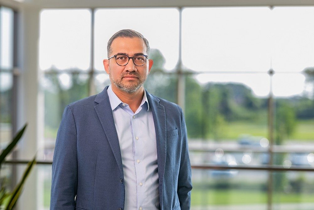 Dr. Mayrol Juarez in a dress shirt and sportcoat