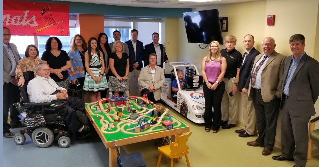 The St. Louis Association of Health Underwriters visited Mercy Children's Hospital to donate a Children's Dream Racer.