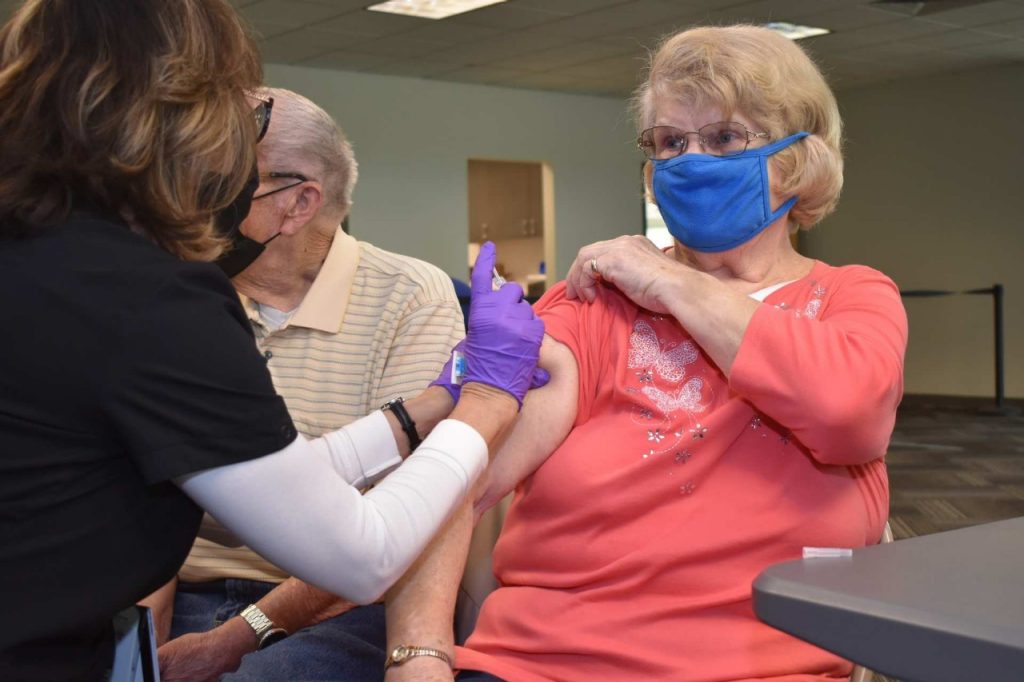 Erika Gerkens receives her second dose of the Pfizer COVID-19 vaccine.
