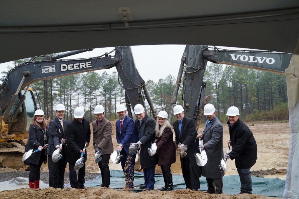 Representatives from Mercy Fort Smith, Arkansas Colleges of Health Education, Kindred Healthcare and others turn the dirt during the groundbreaking of the new Mercy Rehabilitation Hospital Fort Smith on Feb. 12.