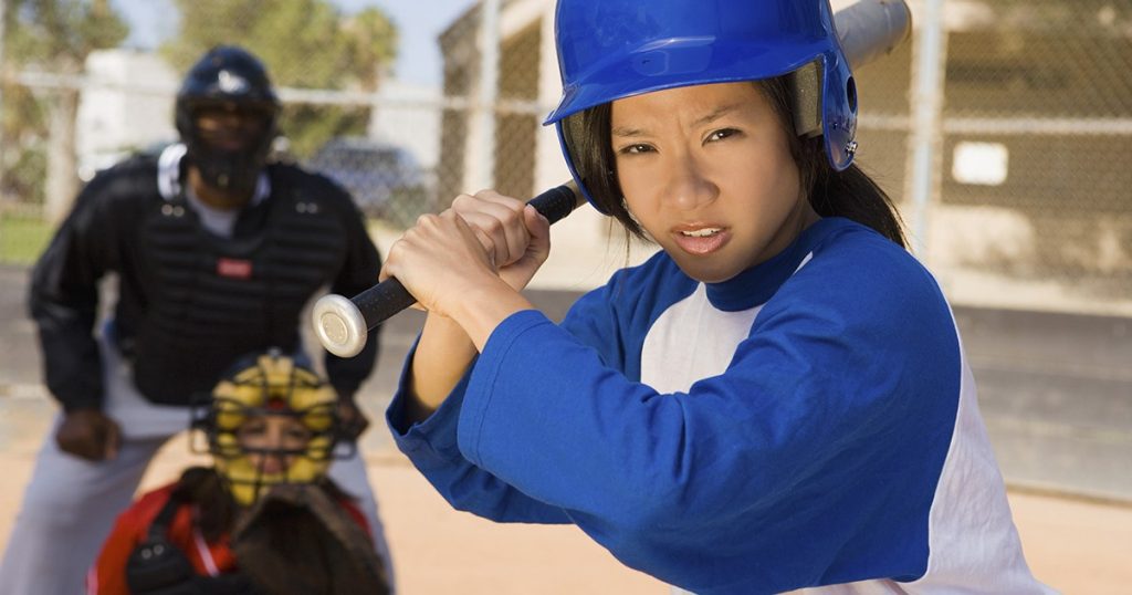 girl_softball_player_blue_helmet_486650553