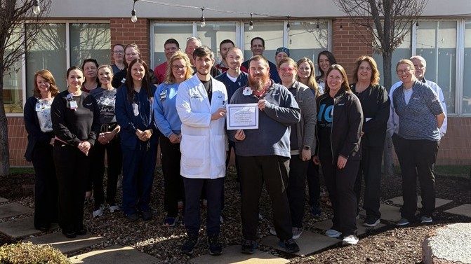 Stroke medical director Dr. Marshall Kirsch and stroke program coordinator Josh Ennis hold the new certificate designating Mercy Hospital Jefferson as a Level 2 Stroke Center. Standing behind them are members of various units from across the hospital that support stroke care and make up the stroke team.