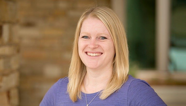 Head shot of Amanda Laughlin in a purple top