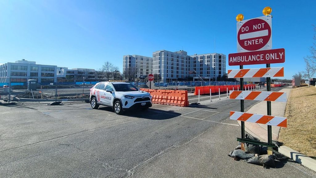 Drivers entering the main drive from Kennerly Road will be required to turn off the main drive. Turning left will lead to the emergency entrance, which is now located at the main entrance under the blue awning. Turning right will lead to the Sindelar Cancer Center and another road to reach the other side of campus.