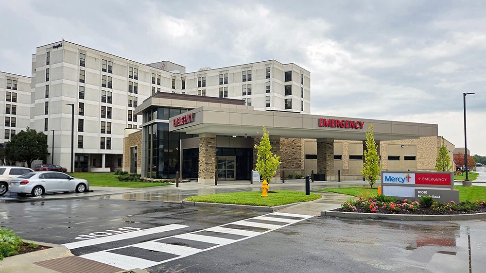 The exterior of the emergency entrance in front of a hospital.