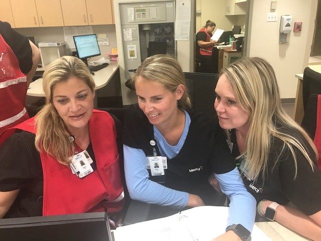 left to right: Sallye Saali, Molly Glaser and Melissa Stephens work together during the Epic go-live on the 5 West Medical/Surgical floor of Mercy Hospital South.