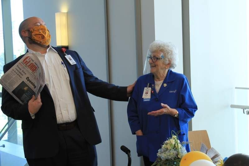 Jeremy Drinkwitz, President of Mercy Hospital Joplin, shares a laugh with Ottie Hinderliter at a reception for her 90th birthday.