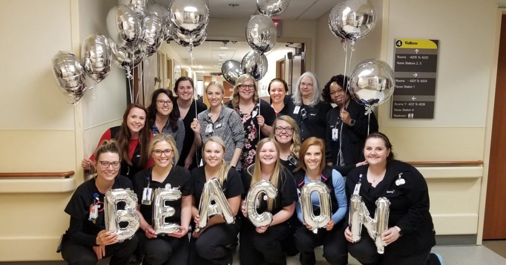 Co-workers from Mercy's Transitional Care Unit gathered to celebrate the Beacon Award.