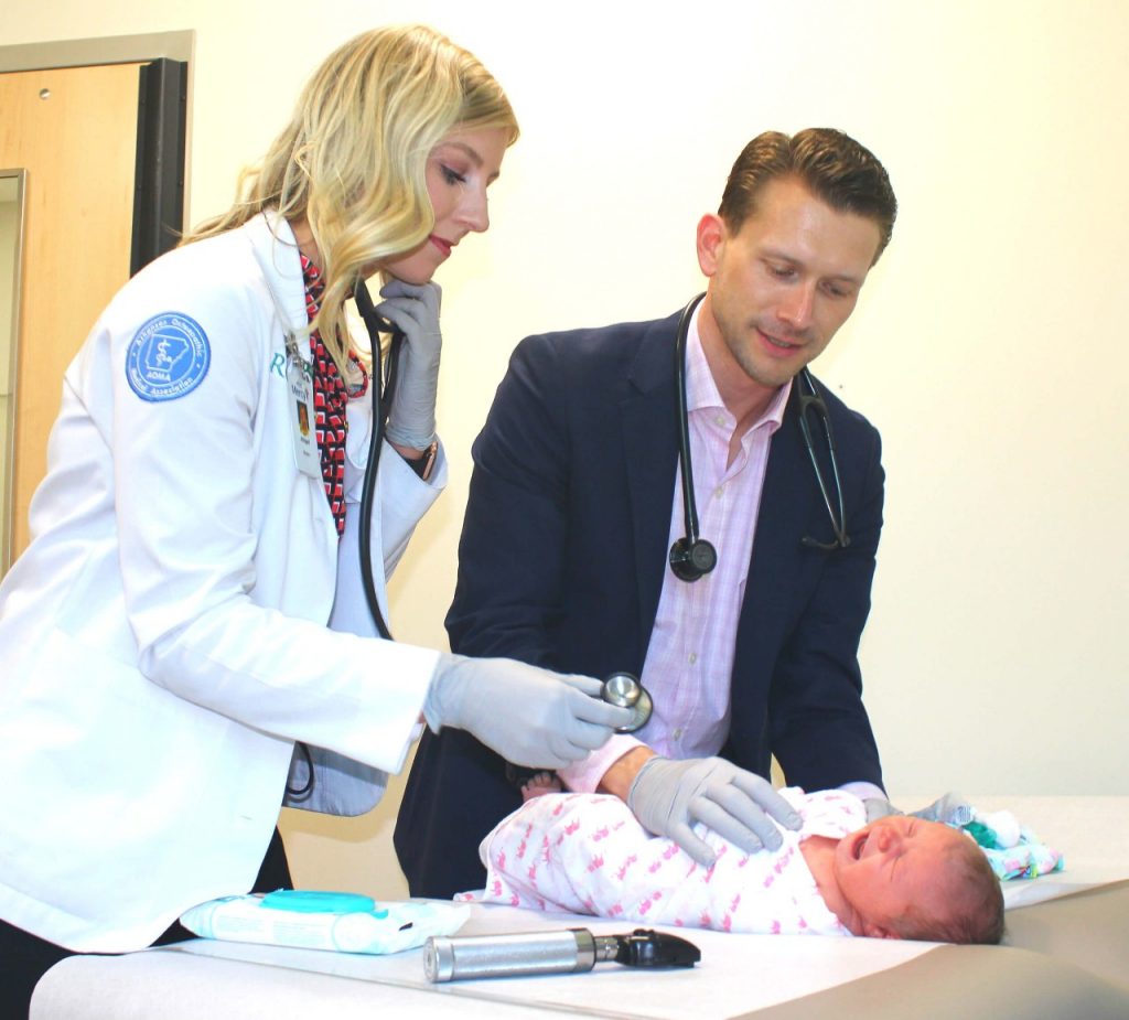 Abby Long, a student from the Arkansas College of Osteopathic Medicine, works with Dr. Kendall Wagner, primary care physician with Mercy Fort Smith. Mercy and the Arkansas Colleges of Health Education have partnered on a new program that will provide residency positions for ACHE students in the coming years. [Photo courtesy ACHE]
