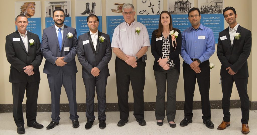 Seven of the 10 nominees for the 2019 Catherine McAuley Physician Leadership Award: Dr. Raymond Weick, Dr. Mahmud Al Furgani, Dr. Aayushman Misra, Dr. Kenneth Kilian, Dr. Sarah Sundet, Dr. Rohan Devanpalli-Ramaya, and Dr. Karthik Iyer. Not pictured, Dr. Amit Doshi, Dr. Kevin Enger, and Dr. Souheil Khoukaz.