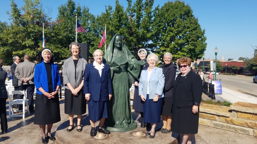 Sister Chabanel Finnegan, third from right, stands with other Sisters of Mercy at the statue of Sisters of Mercy founder Mother Superior Mary Teresa Farrell in downtown Fort Smith.