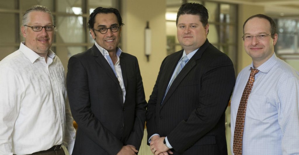 (Left to right) Cardiologists Lance Weathers and Amr El-Shafei and cardiothoracic surgeons Matthew Parmley and Anton Cherney make up the team performing transcatheter aortic valve replacement, known as TAVR, at Mercy Hospital Northwest Arkansas.