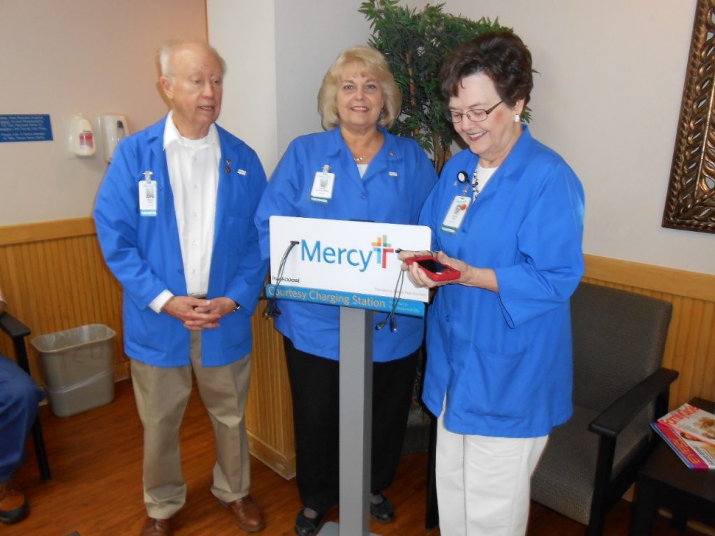 Ada Auxiliary members at a cell phone charging station