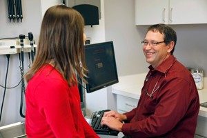 Dr. Arthur Hale Jr. speaks with a patient